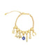 A gold charm bracelet features various dangling lucky charms, including an evil eye, an elephant, a key, and a horseshoe.