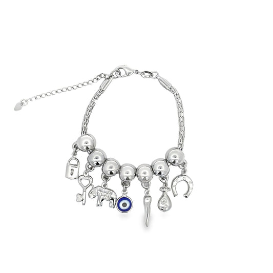 A silver charm bracelet features various symbolic dangling charms including an elephant, evil eye, horseshoe, and lock against a plain white background.