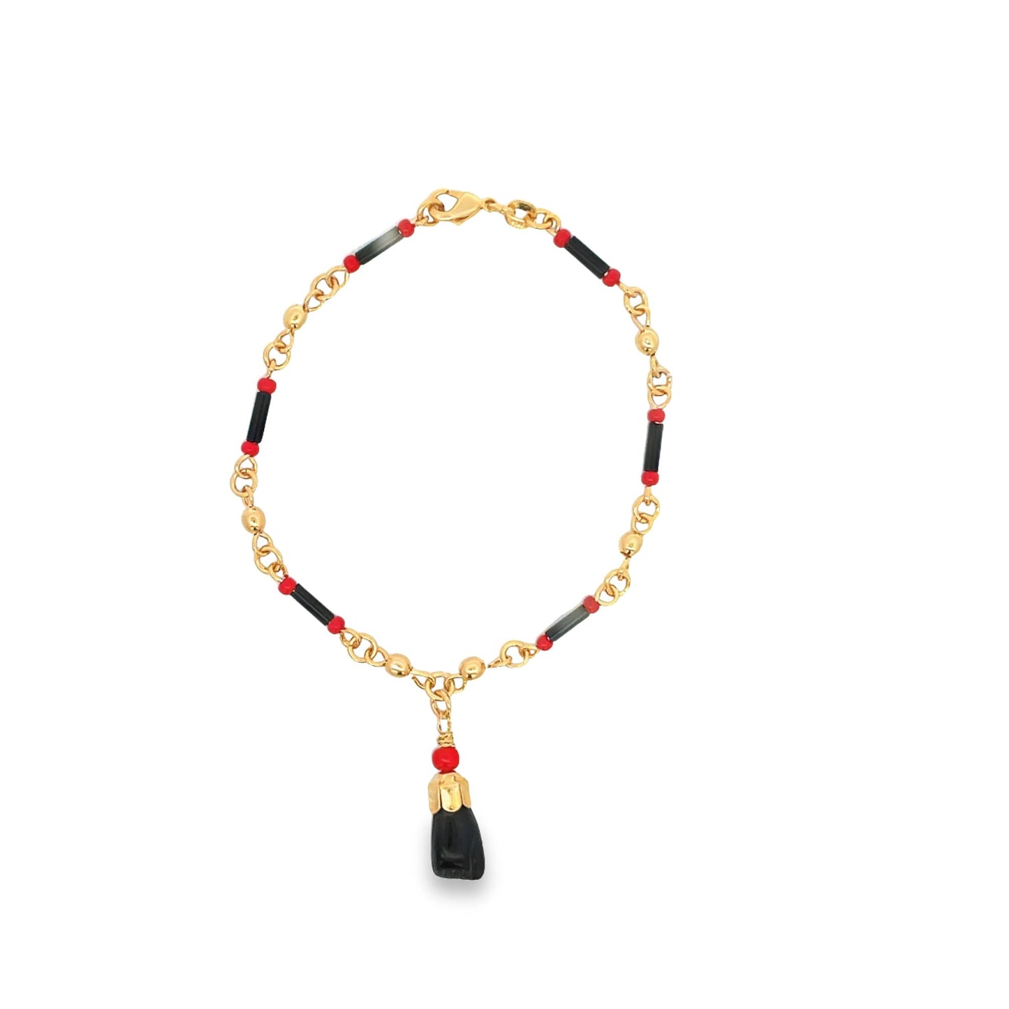 A gold chain necklace features black and red beads accented by a hanging figa charm.