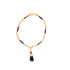 A gold chain necklace features black and red beads accented by a hanging figa charm.