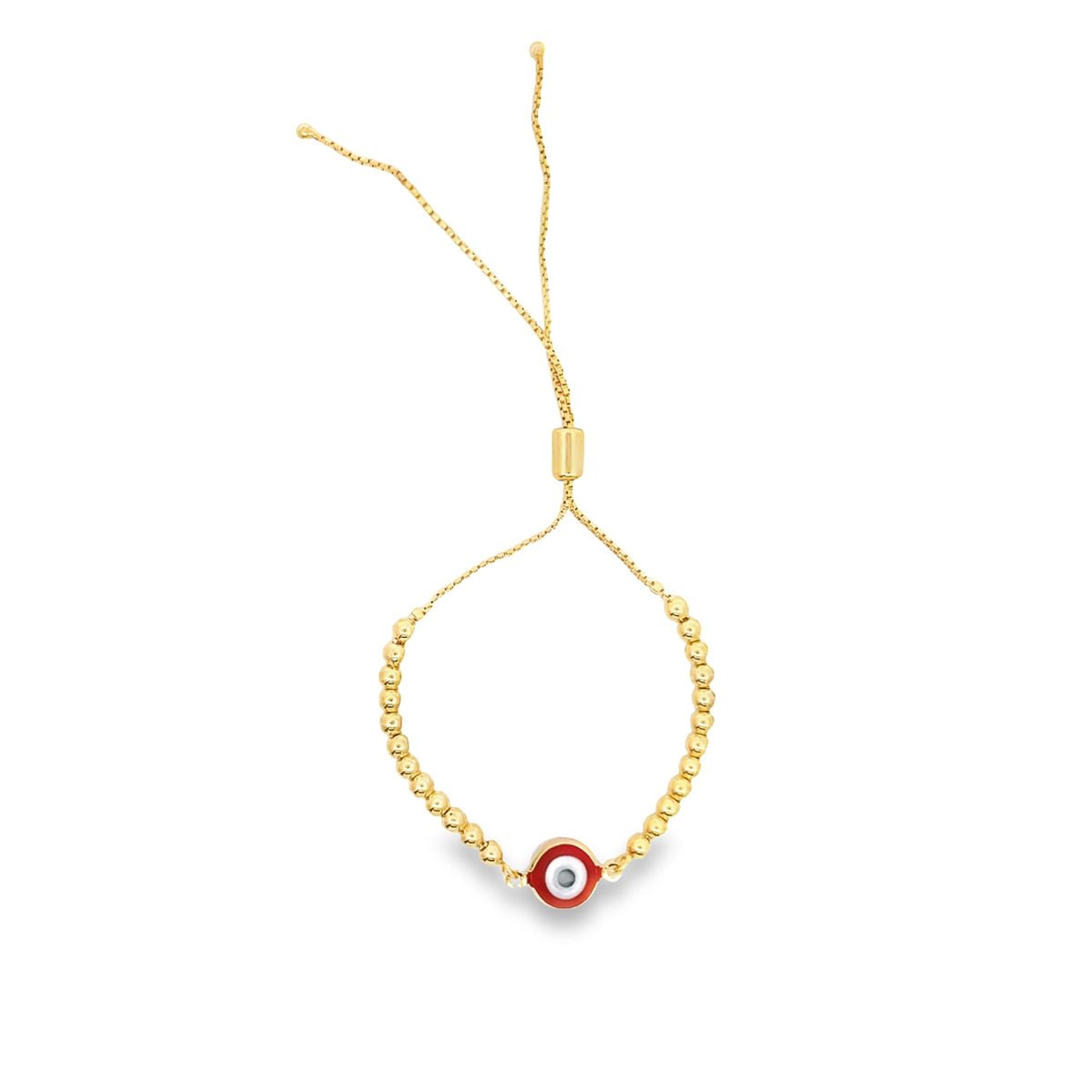 A delicate gold bolo bracelet features a red and white evil eye charm against a plain white background.