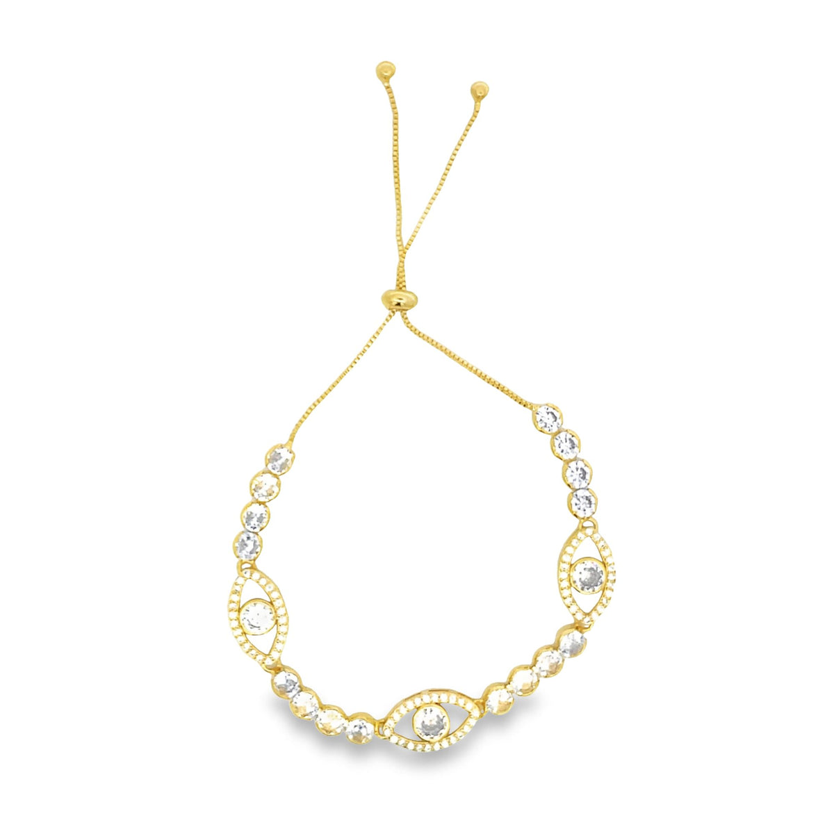 A delicate gold bolo bracelet features sparkling cubic zirconia evil eye charms and an adjustable sliding closure.