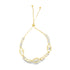A delicate gold bolo bracelet features sparkling cubic zirconia evil eye charms and an adjustable sliding closure.
