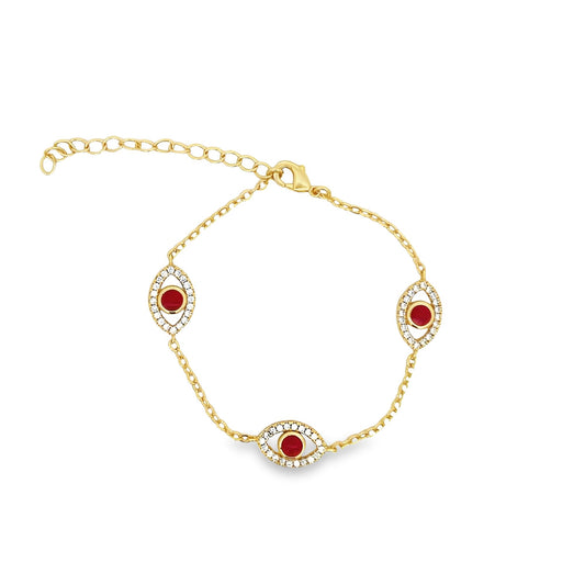 A delicate gold chain bracelet features three evil eye charms adorned with sparkling white crystals and vibrant red center stones.
