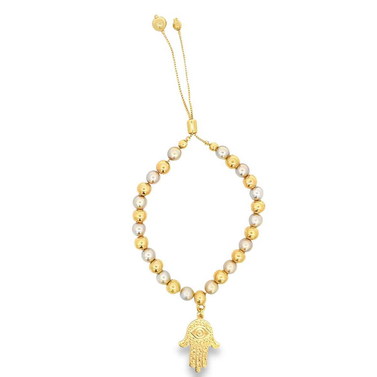 A gold and silver bead bracelet features an adjustable chain closure and a hanging hamsa hand charm.
