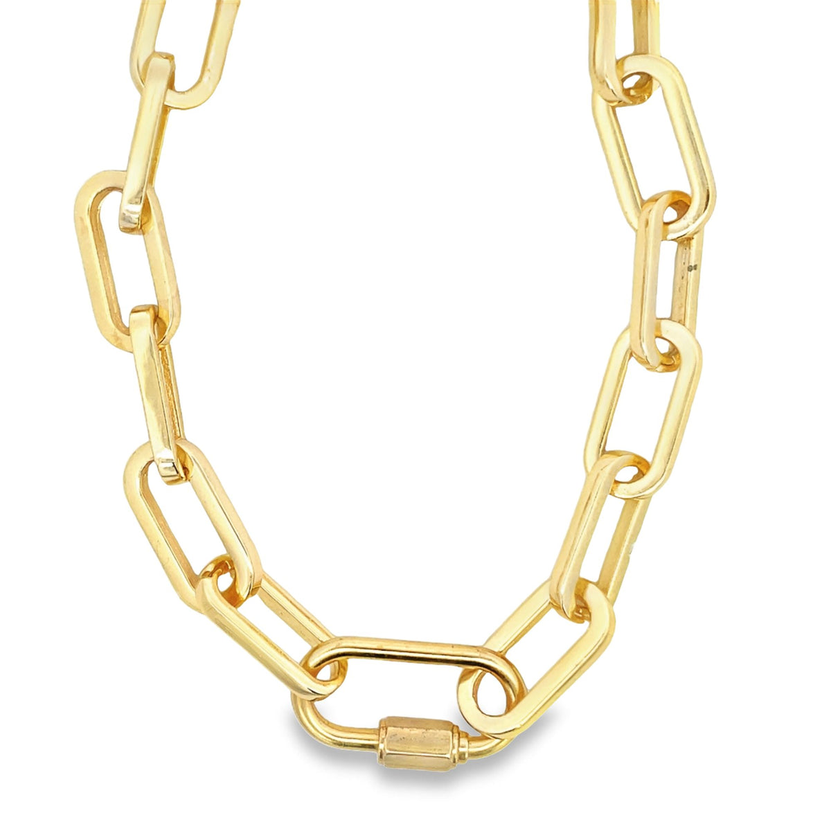 A shiny gold paperclip chain necklace features a prominent rectangular clasp centered at the bottom.