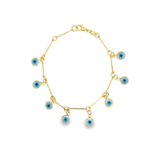 A delicate gold link bracelet features multiple hanging blue evil eye charms.