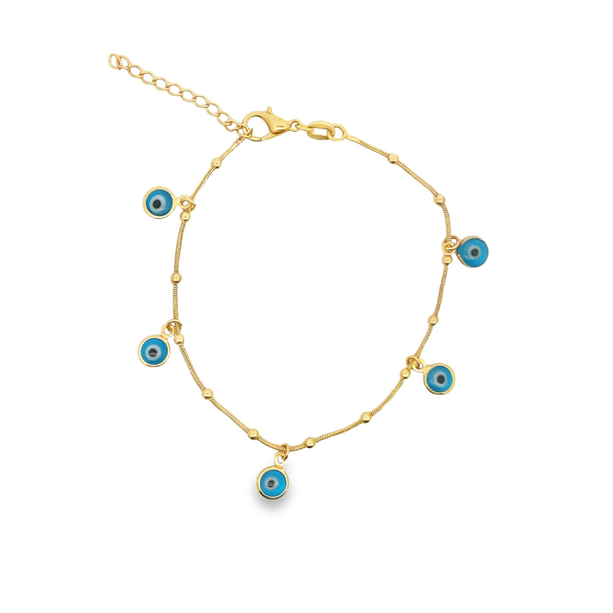 A delicate gold chain bracelet features multiple dangling blue evil eye charms against a white background.