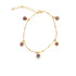 A delicate gold evil eye charm bracelet sparkles against a clean white background, showcasing dangling red protective amulets.