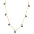 A delicate gold chain necklace drapes downwards, adorned with multiple hanging blue and white evil eye charms.