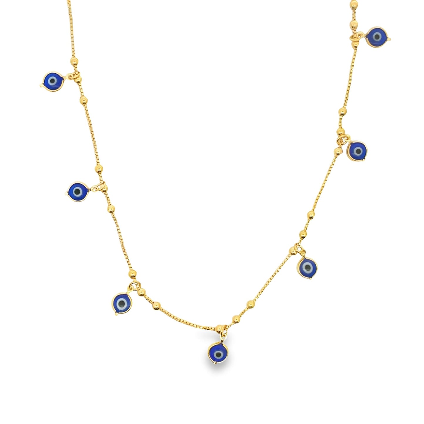 A delicate gold evil eye charm necklace displays multiple blue and white glass charms dangling from a beaded chain against a white background.