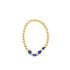 A gold bead stretch bracelet features vibrant blue evil eye charms arranged in the center.