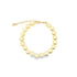 A delicate gold pearl bracelet rests on a clean white background, showcasing its glossy round pearls and adjustable chain clasp.