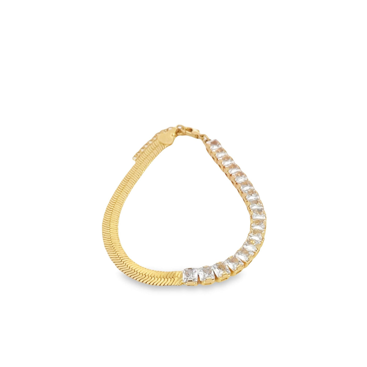 A gold bracelet featuring a smooth herringbone chain on one half and sparkling crystal stones on the other displays a modern design against a white background.