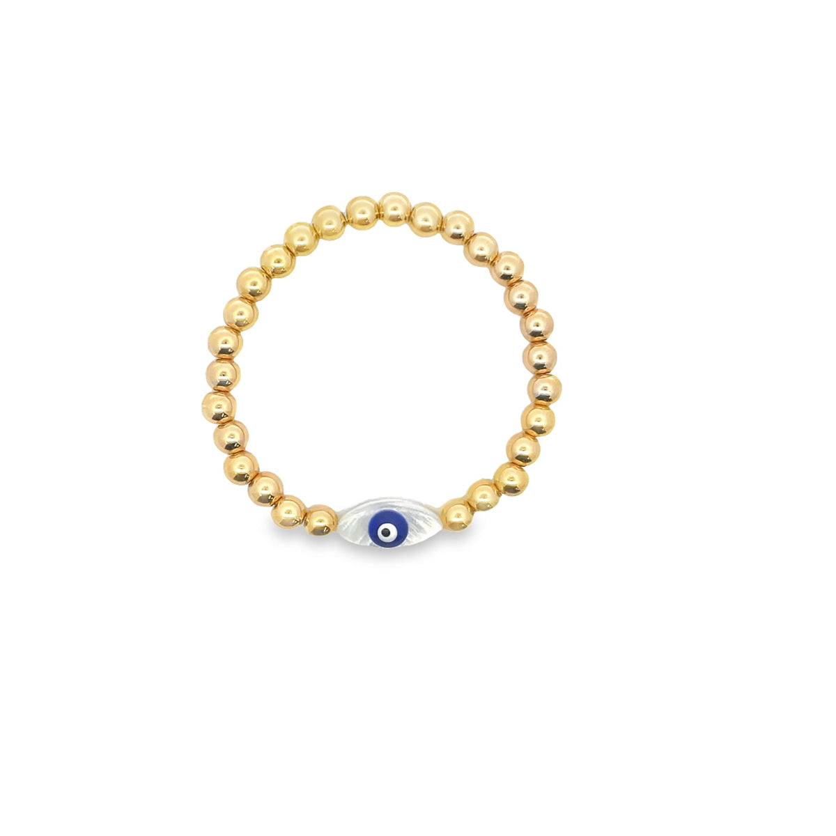 A delicate gold bead stretch ring features a central evil eye charm with blue and white enamel details.