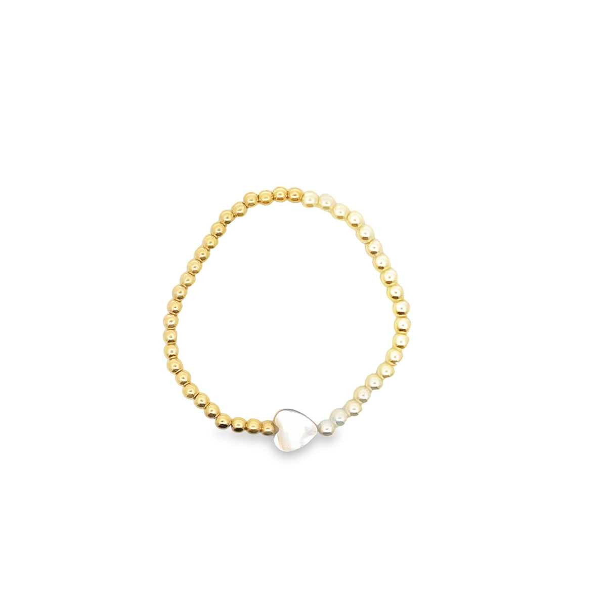 A beaded gold ring features a mother-of-pearl heart charm centered at the bottom.
