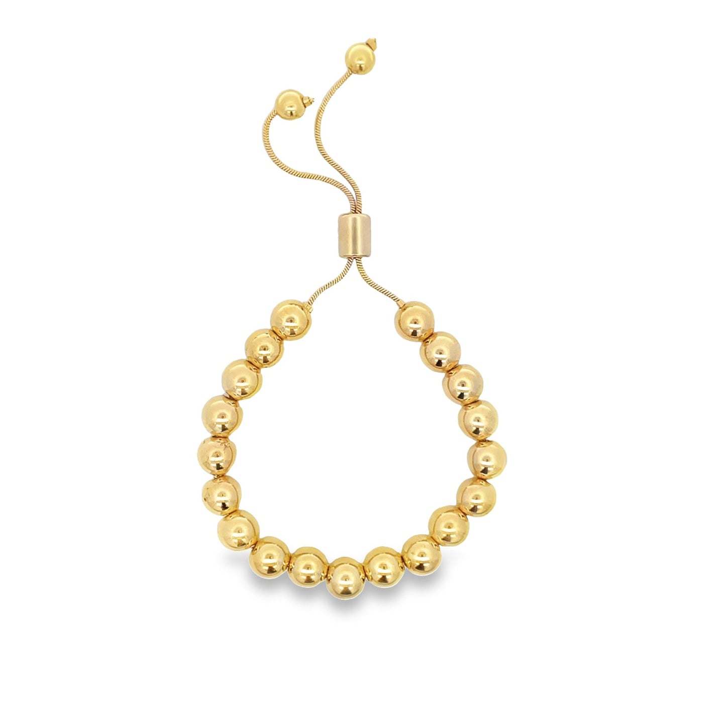 A gold bead bolo bracelet features a row of polished round metal spheres on an adjustable chain with sliding clasp closure.