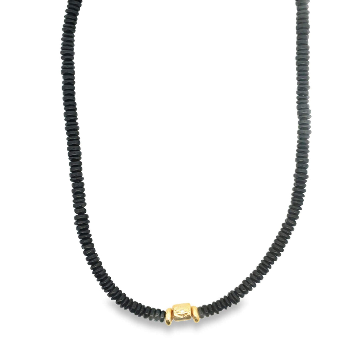 A black beaded necklace features a single gold accent piece centered at the bottom.