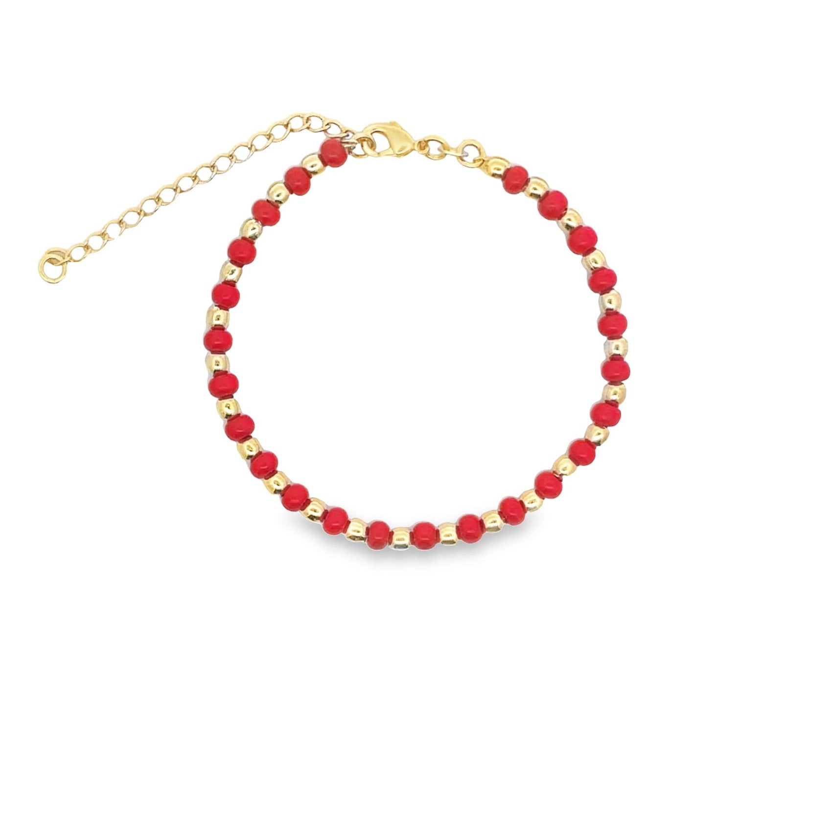 A gold-accented beaded bracelet features alternating red and metallic gold beads arranged in a circle against a clean white background.
