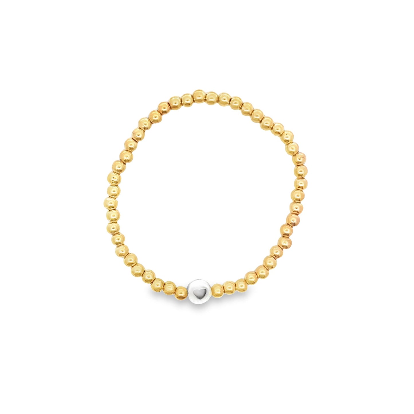 A gold beaded stretch bracelet features a central silver bead with an engraved heart.