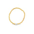 A gold beaded stretch bracelet features a central silver bead with an engraved heart.