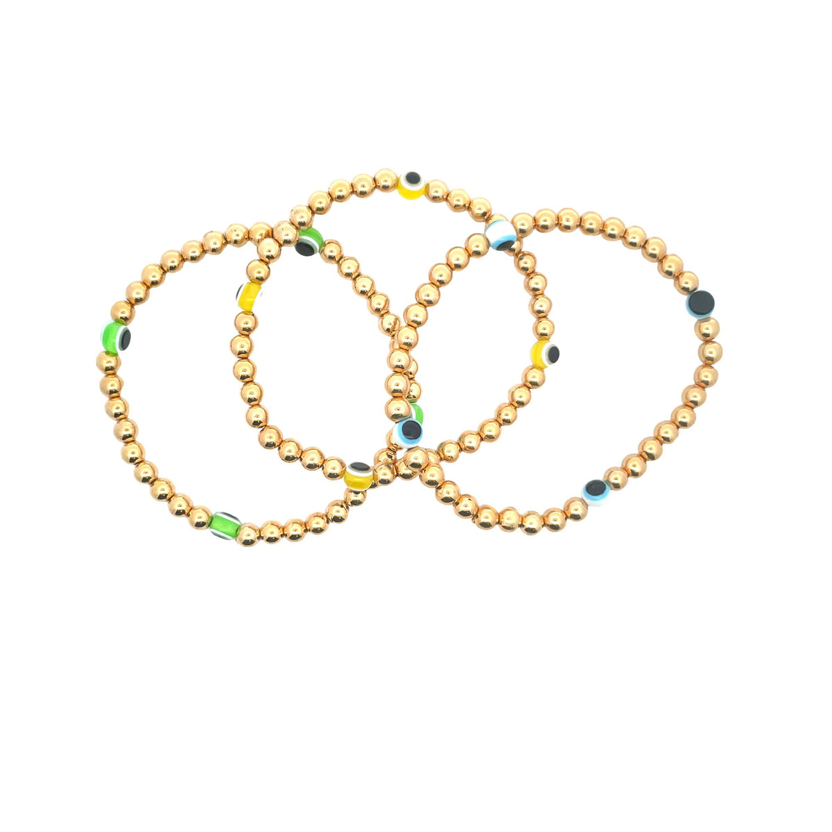Three gold ball bead bracelets accented with colorful evil eye beads intertwine on a white background.