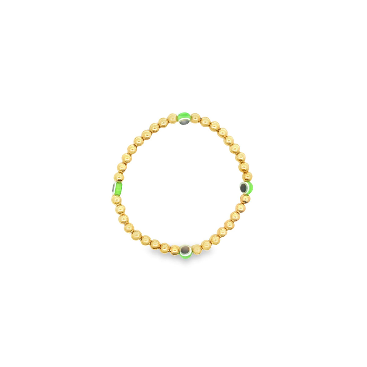 A delicate gold bead bracelet features interspersed green evil eye charms against a clean white background.