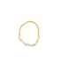A delicate gold beaded ring features a string of sparkling bezel-set diamonds along the bottom.