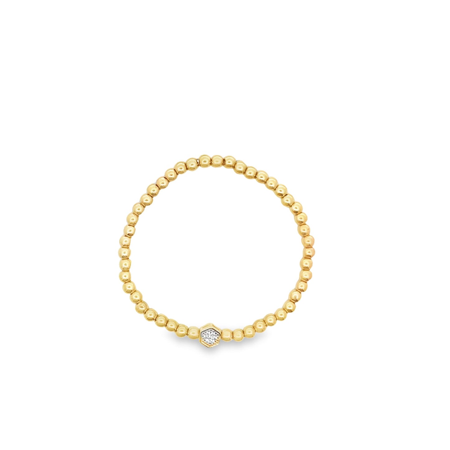 A delicate gold beaded ring features a sparkling hexagonal diamond accent at the center.