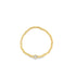 A delicate gold beaded ring features a sparkling hexagonal diamond accent at the center.