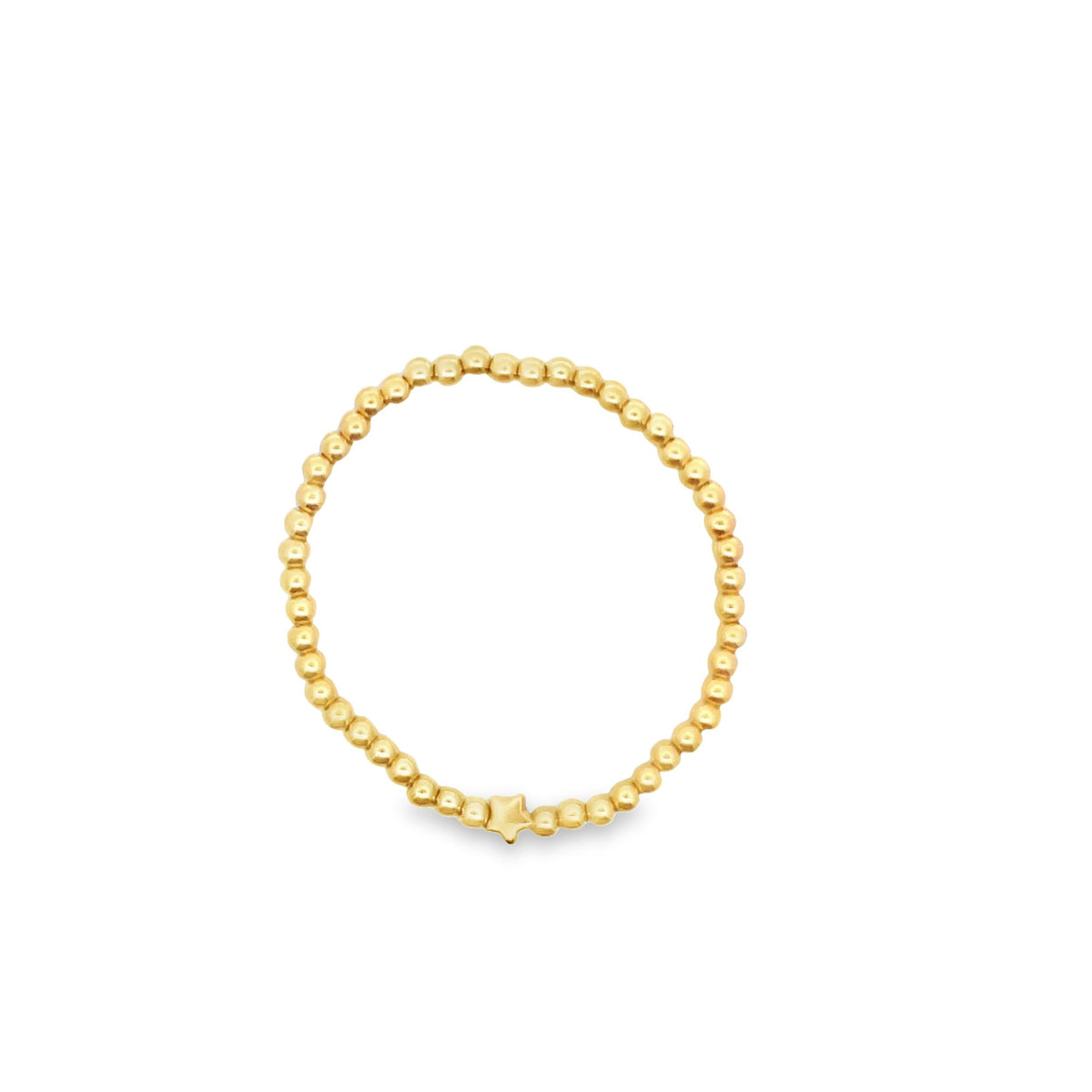 A gold beaded stretch ring features a small star charm centered at the bottom against a plain white background.