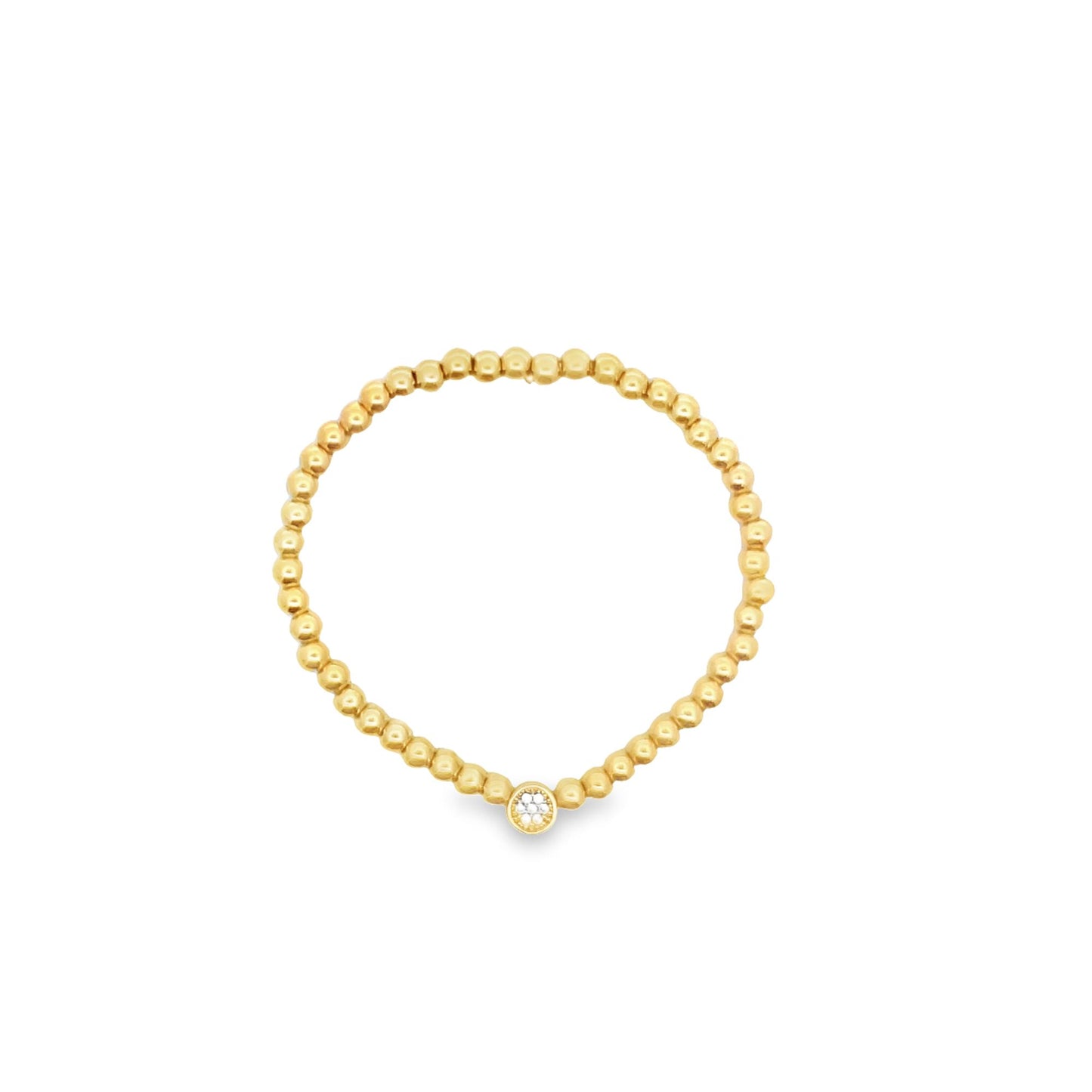 A delicate gold beaded stretch ring features a single diamond accent stone centered at the bottom against a clean white background.