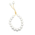 An elegant adjustable pearl bracelet features glossy white pearls strung on a delicate gold chain with a slider mechanism.