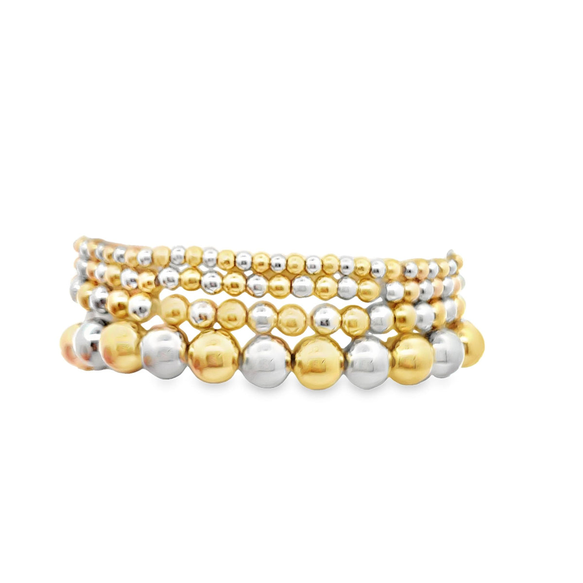 A stack of shiny gold and silver beaded stretch bracelets displays alternating metallic spheres against a clean white background.