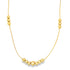 A delicate gold chain necklace features clusters of polished bead accents along its length.
