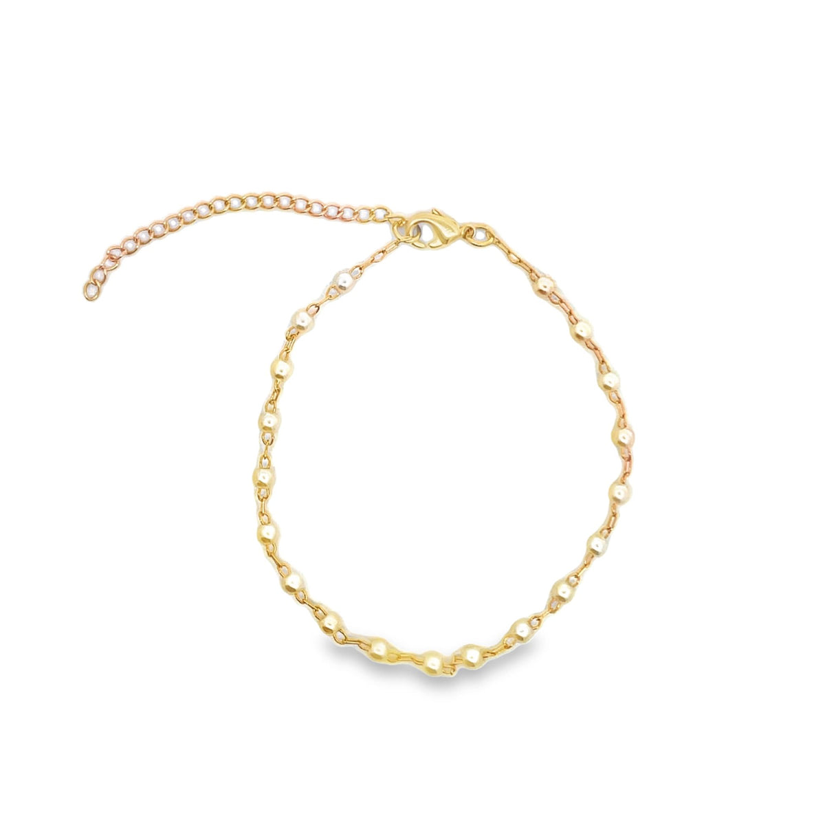 A delicate gold bead chain anklet features a lobster clasp and an adjustable extension chain against a clean white background.