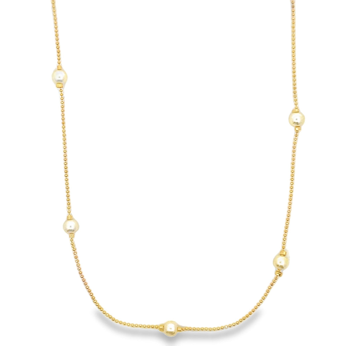A delicate gold chain necklace features scattered white pearls and polished gold beads along its length.