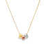A delicate gold chain necklace dangles three interlocking cube charms in yellow, rose, and white gold.