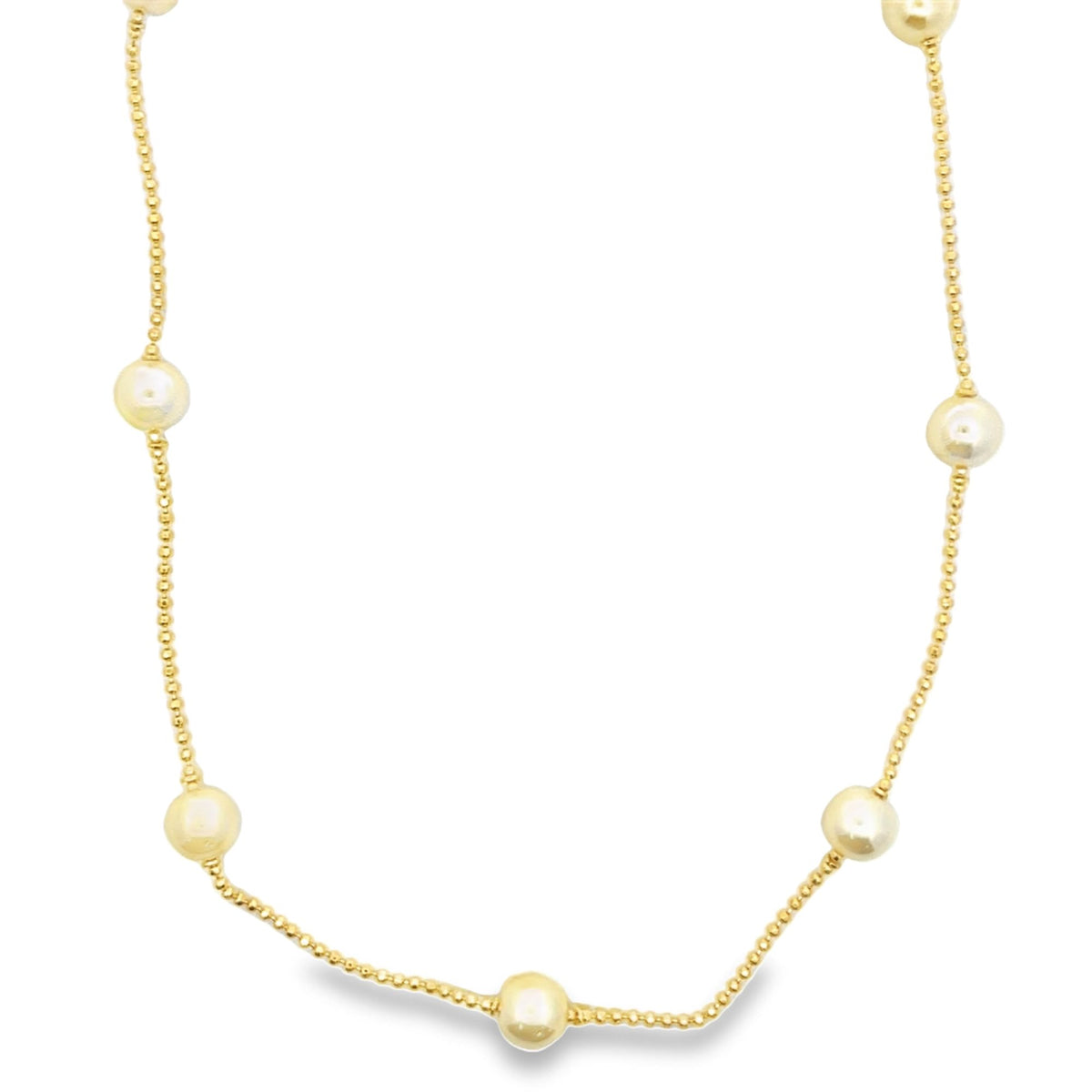 A delicate yellow gold beaded chain necklace features evenly spaced pearl stations against a clean white background.