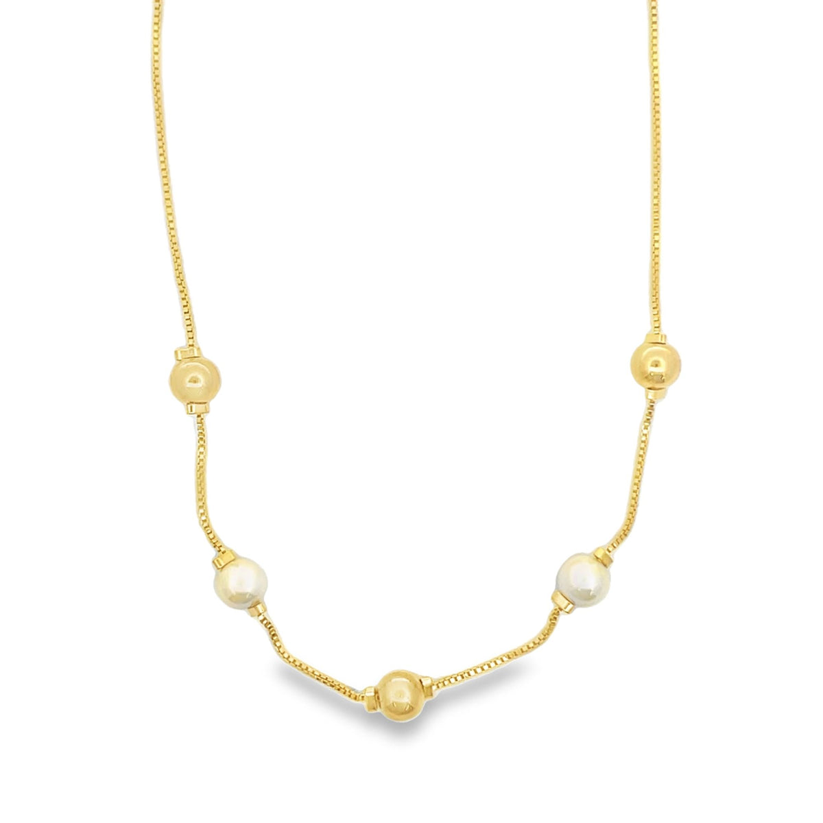 A delicate gold chain necklace features alternating gold beads and white pearls against a clean white background.