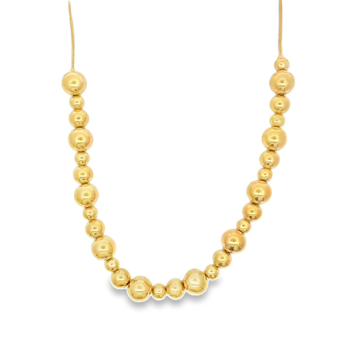 A stunning gold bead necklace rests elegantly against a clean white background, showcasing its graduated polished spheres.