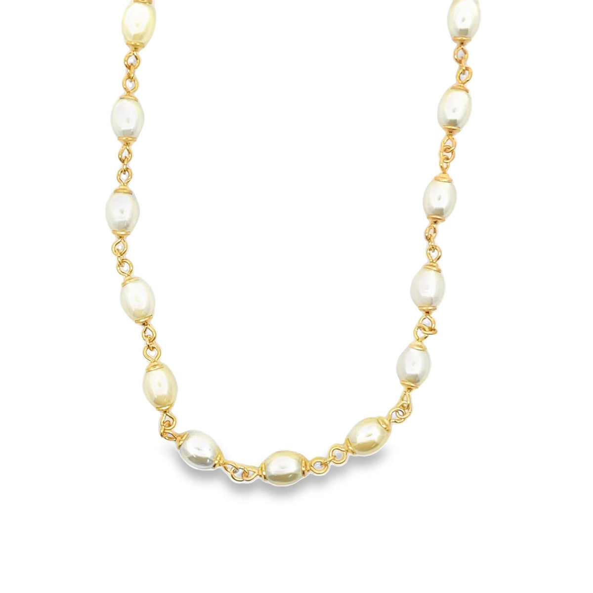 A delicate gold chain necklace features alternating oval freshwater pearls against a clean white background.
