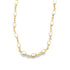 A delicate gold chain necklace features alternating oval freshwater pearls against a clean white background.