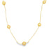 A delicate gold chain necklace drapes elegantly, featuring evenly spaced polished round gold beads against a clean white background.