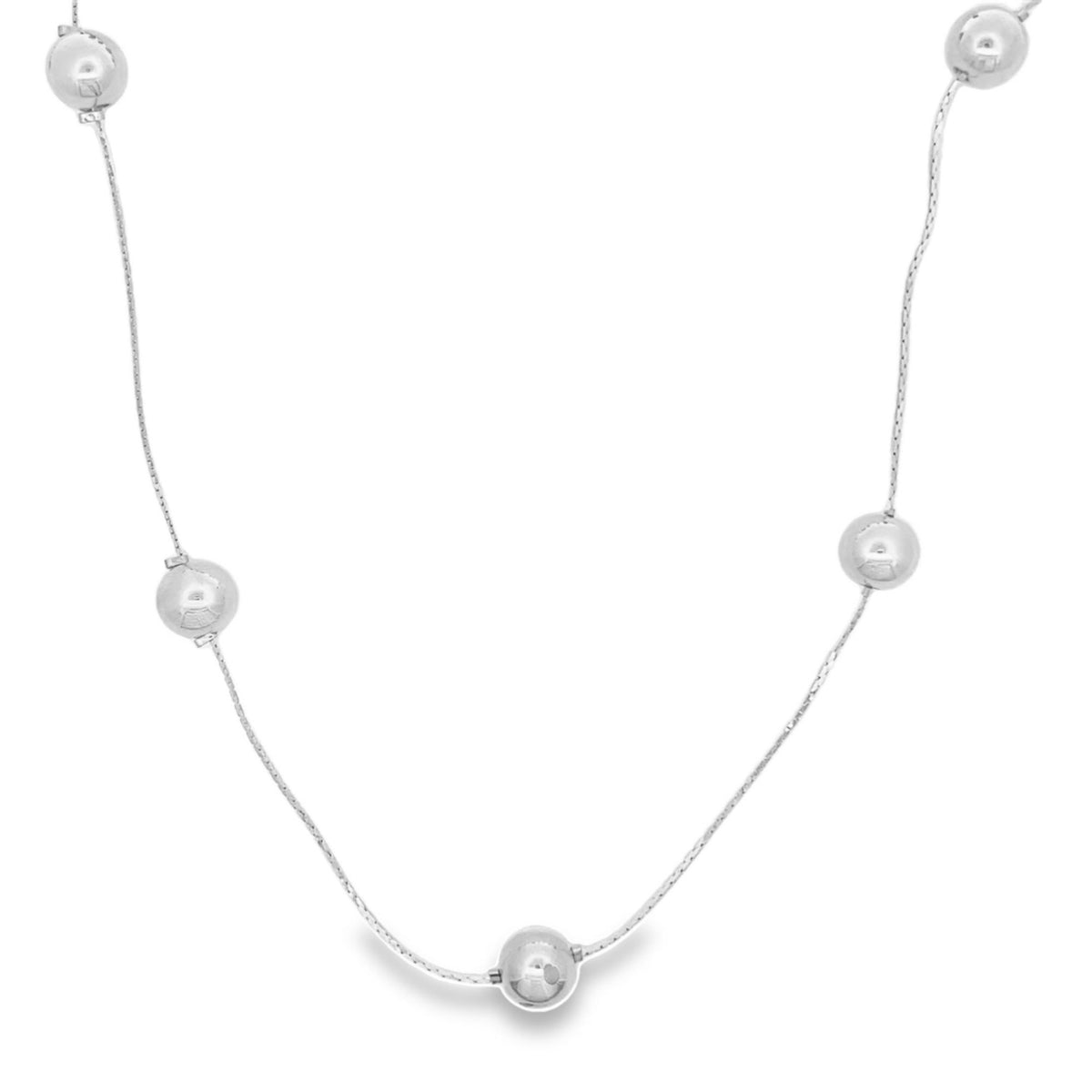 A delicate sterling silver chain necklace features evenly spaced polished bead stations against a plain white background.