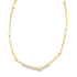 A minimalist gold chain necklace features alternating yellow gold bars and small bead accents against a clean white background.