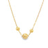 A delicate gold paperclip chain necklace features three polished bead charms suspended gracefully in the center.