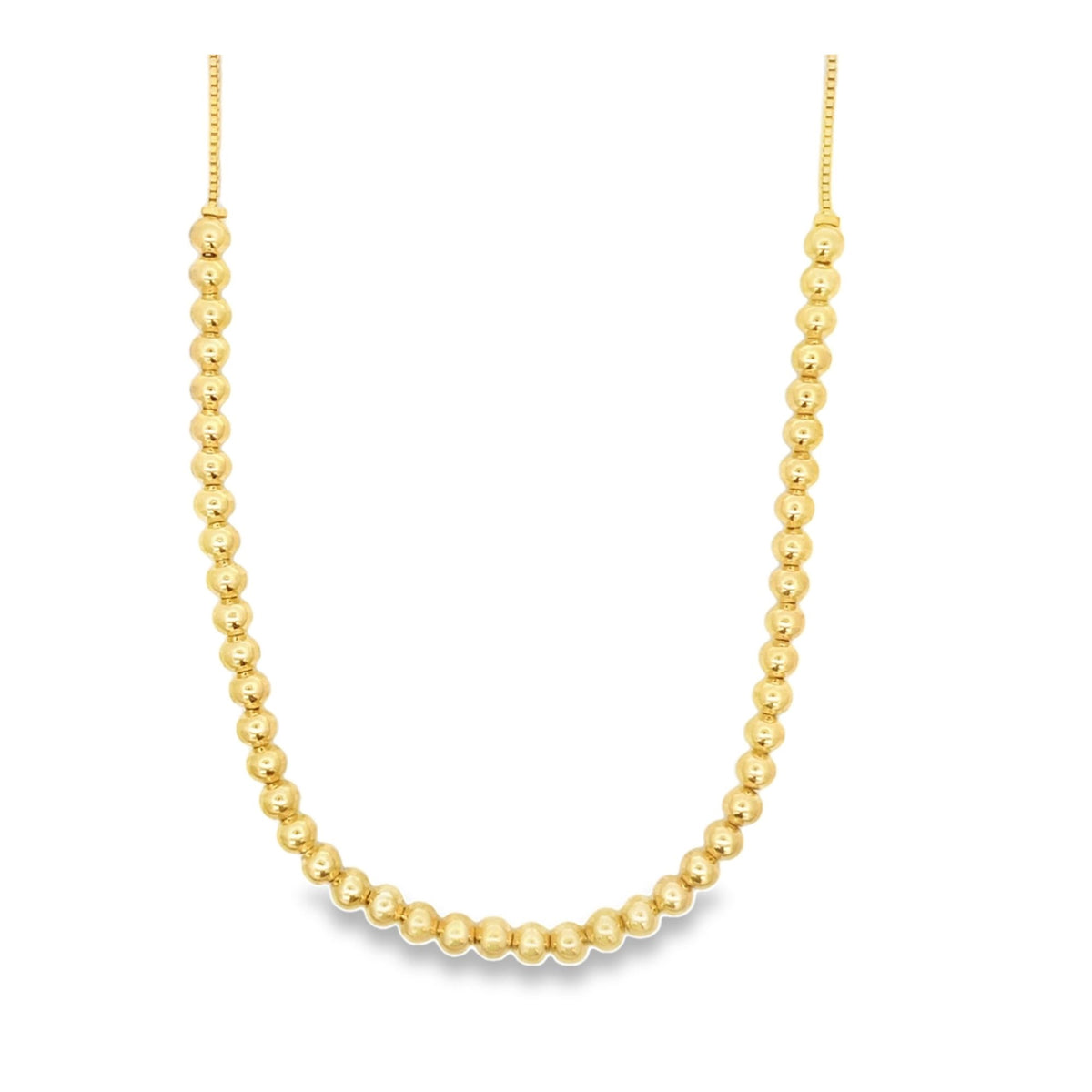 A gleaming gold bead necklace displays a uniform row of polished spherical beads linked together.