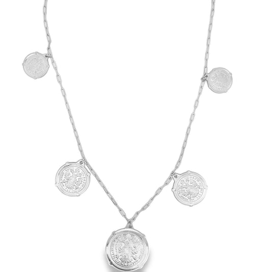 A silver paperclip chain necklace features five hanging coin charms with intricate embossed details against a plain white background.