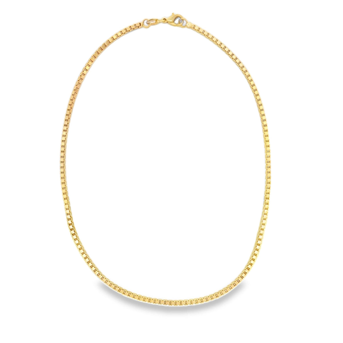 A polished yellow gold box chain necklace rests in an oval shape against a white background.